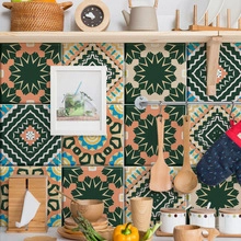 Kitchen backsplash featuring retro mandala geometric tile stickers in green and orange tones