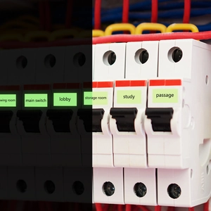 Luminous home circuit breaker labels with green glow for main switch and study room