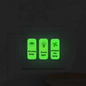 Luminous light switch stickers with English labels glowing brightly in the dark