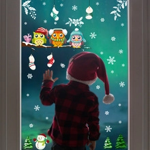 Detailed Christmas window stickers featuring colorful cartoon owls, snowmen and trees