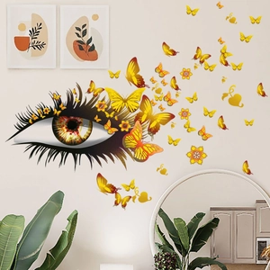 Sticker mural détaillé d'un œil avec des papillons dorés et des fleurs décoratives