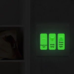Luminous light switch stickers showing cloakroom, study, and storeroom icons in green glow