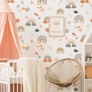 Boho rainbow and botanical wall stickers applied in a cozy nursery room setting