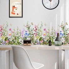 Rainbow floral static window film and wall stickers on a white desk workspace wall