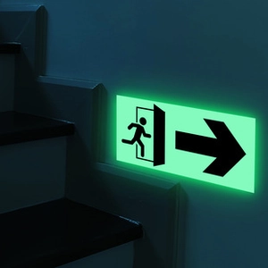 Glow-in-the-dark emergency exit sticker with green luminous running man and arrow
