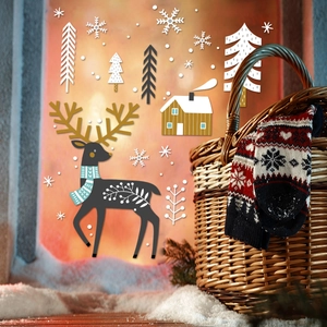 Christmas themed wool socks with reindeer and snowflake patterns in a wicker basket