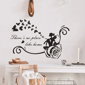 Close-up of black PVC wall decal with flower fairy, butterflies and Home quote