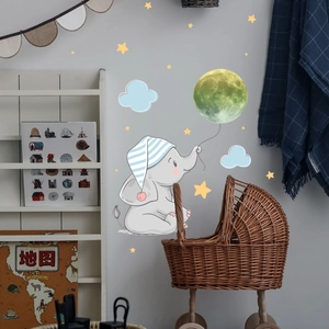 Detailed wall sticker featuring a cute elephant with a moon balloon and stars decor