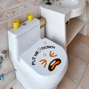 Detail of Put Me Down toilet lid sticker featuring an angry emoji on white background
