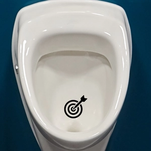 Bullseye target decal for toilet urinal aimed to improve cleanliness in bathrooms