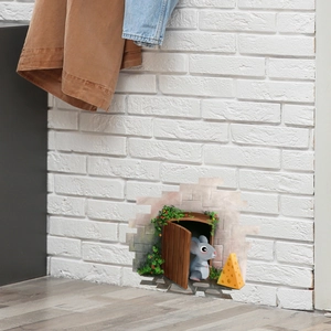 3D wall sticker featuring a cartoon mouse hole with cheese on white brick background