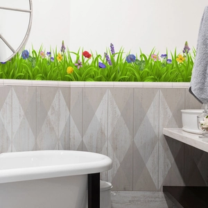 Detail of vibrant green grass skirting wall sticker with colorful small floral patterns