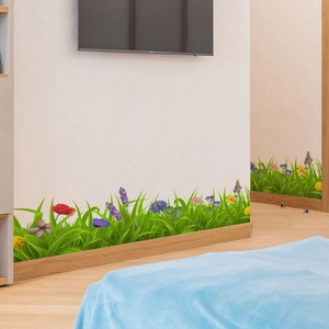 Detail of floral wall sticker with red poppies and lavender on white baseboard