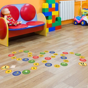 Macro shot of 37 colorful sensory floor decals with numbers and action game instructions