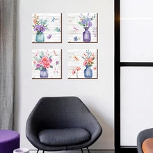 Set of 4 watercolor floral plant wall art stickers on a modern living room white wall