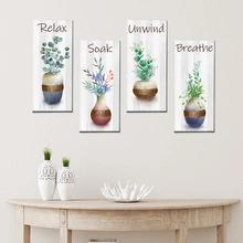 Detailed view of four botanical wall art prints with Relax Soak Unwind Breathe text
