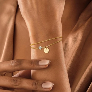 Elegant gold double-layer anklet with zircon flower charm and engraved letter A medal