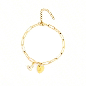 Gouden titanium paperclip armband met hartvormige hanger en zirkonia steentjes