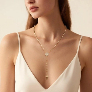 Minimalist gold beaded long necklace with engraved round medallion and cross pendant
