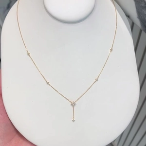 Sparkling zircon four-leaf clover tassel necklace in gold-tone luxury style for women