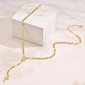 Fashionable golden rosary cross necklace with beaded chain and heart-shaped pendant