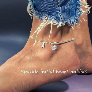 Sparkling silver initial heart anklet with CZ paved letter A on a cuban chain