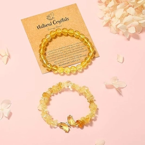 Natural yellow crystal bead bracelet set with butterfly pendant on display card