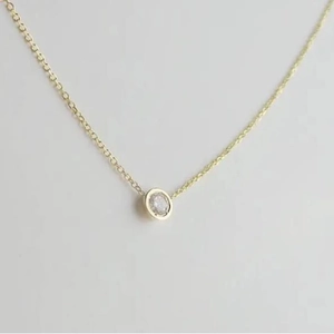 Elegant gold choker necklace with a minimalist round crystal bezel-set pendant for women