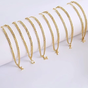 Gold layered stainless steel anklet with capital letter pendants and cuban link chain