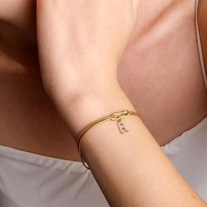 Golden snake chain bracelet with zircon letter R charm and knot design for women