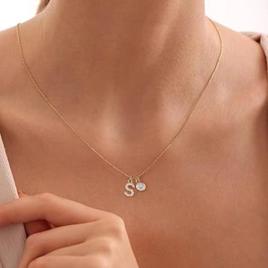Elegant gold choker necklace with Zirconia letter S pendant and single diamond accent