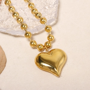 Modern gold-plated stainless steel bead chain necklace featuring a large heart pendant