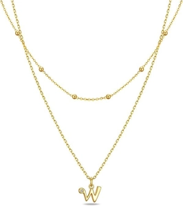 Detail of gold double-layer necklace featuring a letter W pendant and inlaid crystal