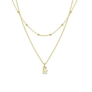 Layered gold stainless steel necklace with bead accents and crystal letter k pendant