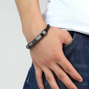 Men's braided black leather bracelet with micro-pave zircon metal beads on hand