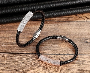 Detail view of woven black leather bracelets with crystal charms and magnetic buckles