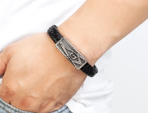 Men's black braided leather bracelet with vintage Masonic G-symbol magnetic clasp