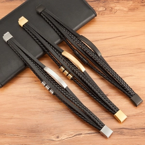 Three-piece men's braided leather bracelet set with gold, silver and black magnetic clasps