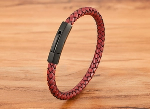 Close-up of red braided leather cord with matte black stainless steel hexagon clasp