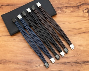 Detail of multi-layer braided leather bracelets for men with stainless steel magnetic clasps