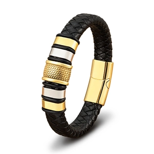Detail of men's braided leather bracelet with gold metal beads and magnetic clasp