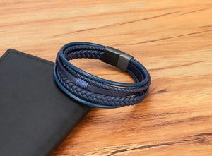 Detail of dark blue multilayer leather braided bracelet with black matte magnetic clasp