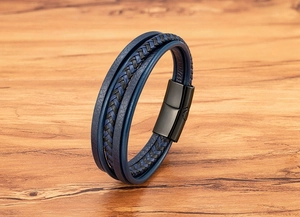 Close-up of multilayer braided blue leather bracelet with black magnetic metal clasp