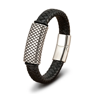 Close-up of black braided leather bracelet featuring a silver engraved metal buckle