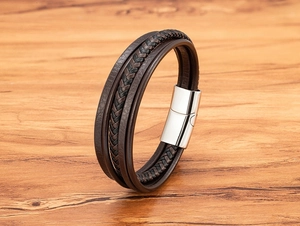 Detail view of multi-layer leather bracelet with polished magnetic steel clasp