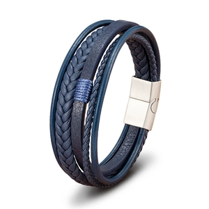 Detail of multi-layer blue leather braided bracelet with brushed silver magnetic clasp