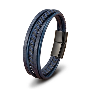 Detail of three-layer braided leather bracelet with black magnetic metal clasp for men