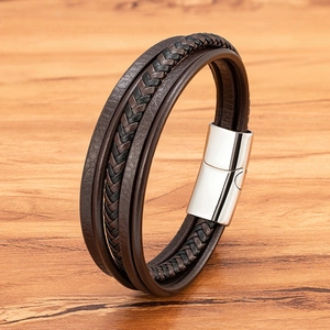 Men's multilayer leather bracelet with braided brown cords and polished magnetic clasp