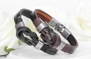 Detailed close-up of woven leather bracelets with vintage knot design and metal clasps