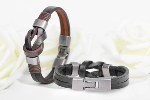 Detail of hand-woven leather bracelets with retro alloy clasps and vintage textures